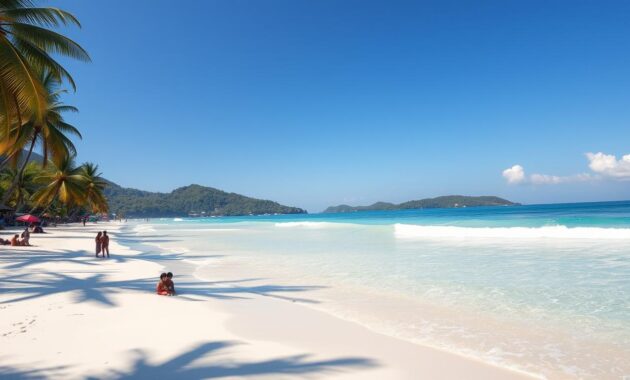 A tranquil beach scene in Phuket, showcasing soft, fine white sand gently lapping at crystalline turquoise waters. In the foreground, a few small, modestly dressed beachgoers are enjoying a quiet day, perhaps building sandcastles or strolling along the shore. The middle ground features smooth waves glistening under the warm golden sunlight, with a few colorful beach umbrellas providing shade. Tall palm trees frame the scene on the left and right, swaying slightly in the gentle breeze. The background reveals distant lush green hills, under a clear blue sky with a few fluffy white clouds. Capture this serene summer day with natural, bright lighting and a wide-angle perspective to emphasize the beauty and peacefulness of Phuket's best beaches, evoking a sense of relaxation and escape.