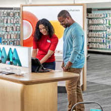 Target employee helping a guest in an electronics department